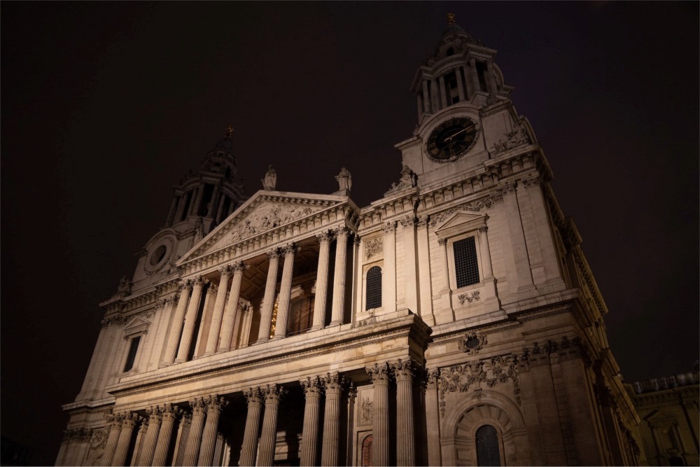 This night photograph shows the Western Facade of St Paul's Cathedral in London England.