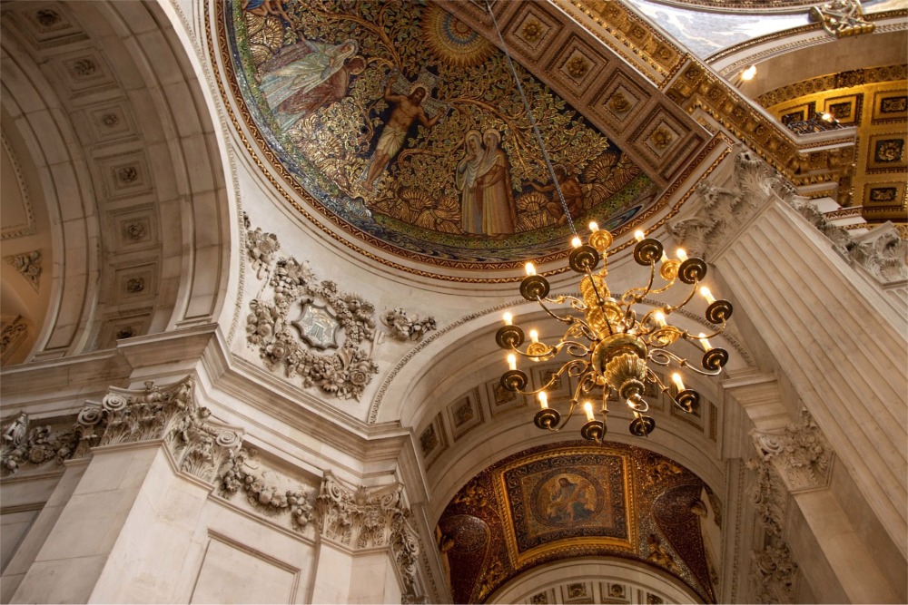 This is a low angle photograph of the interior of St Paul's Cathedral in London England.