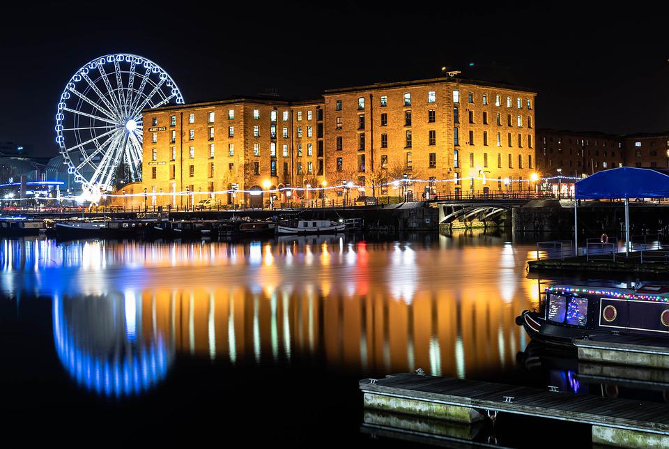 The Royal Albert Dock Liverpool at night with reflection off the water. The Royal Albert Dock, Liverpool, England, UK, United Kingdom